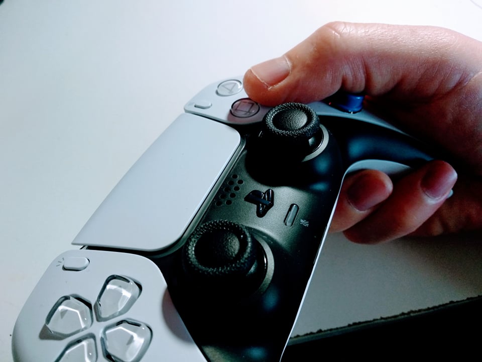 PS5 Dualsense controller with triggers on it