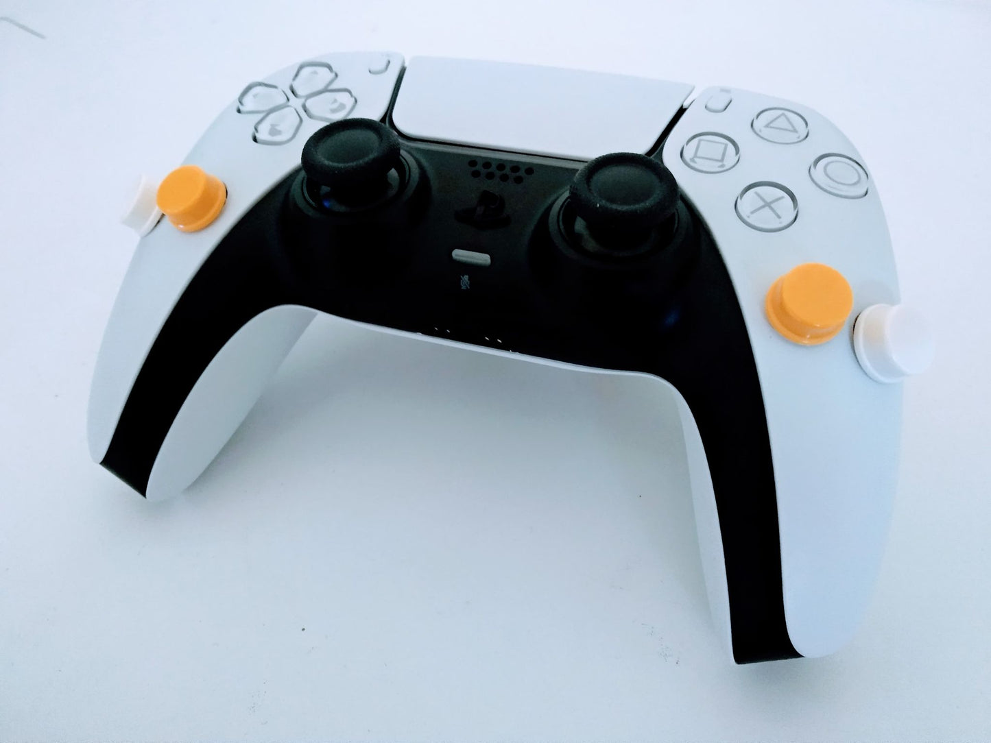 Manette PS5 Dualsense gachettes dessus