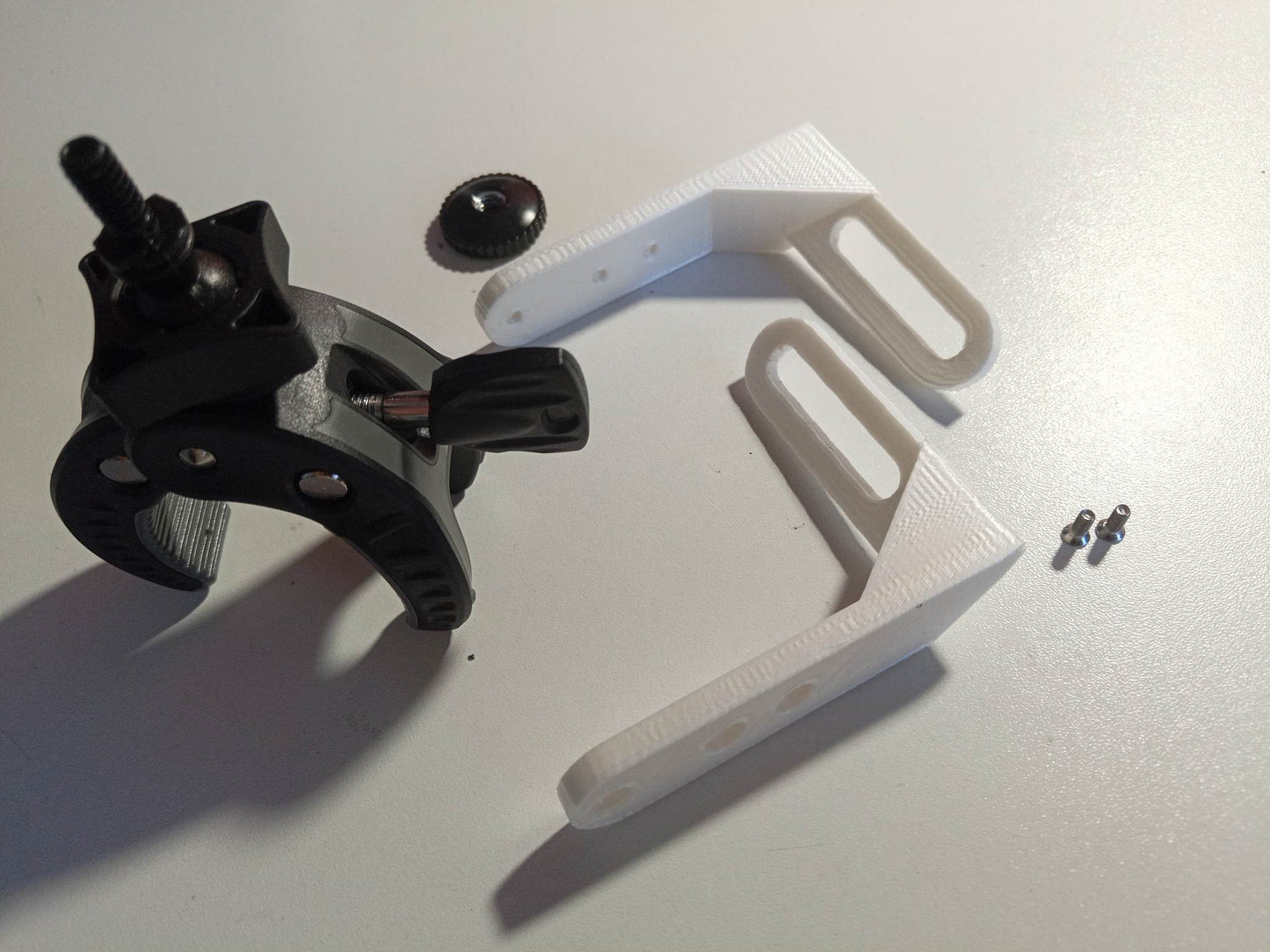 Elbow fixing clamp for 2 Logitech switches