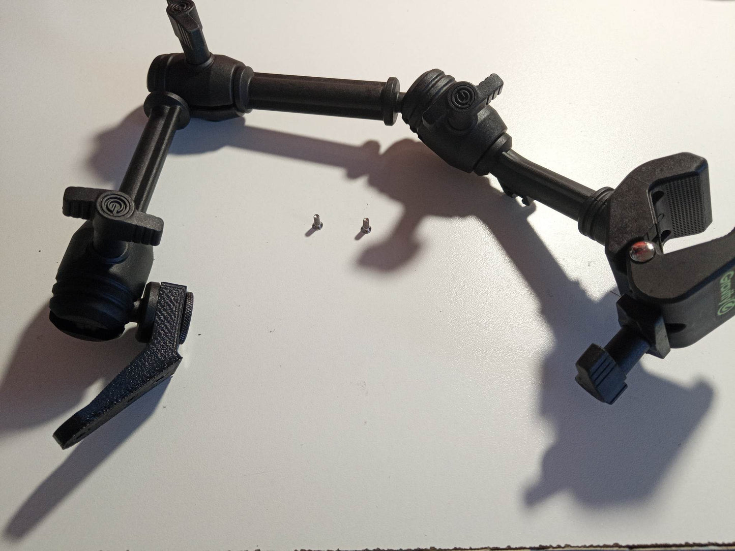Double mounting arm for Logitech switch