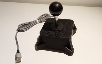 Arcade joystick with ball